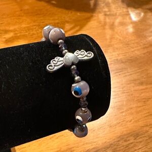 Elegant Silver and Tiger Eye with Evil Eye Graphics. Gray crystals and Wings